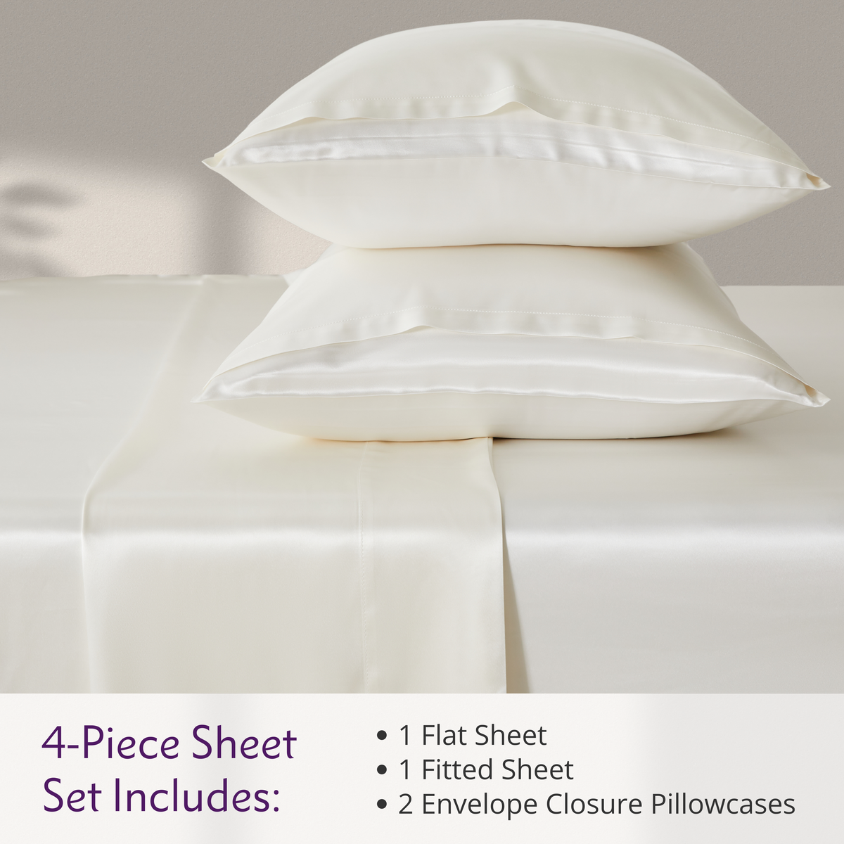 Elegant bed setup featuring a 4-piece sheet set, complete with matching pillows and silk bed sheets