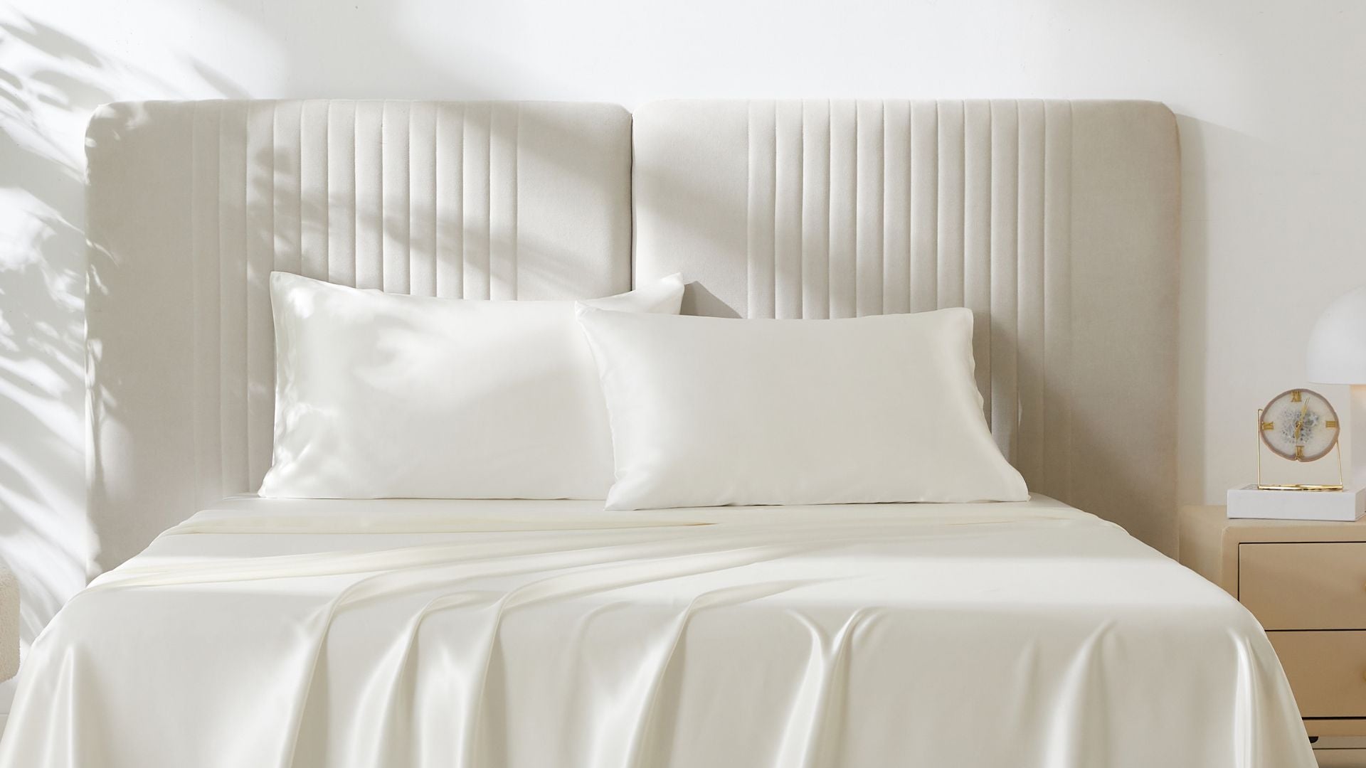 A beautiful bed with two ivory silk pillowcases from Mulberry Park Silks