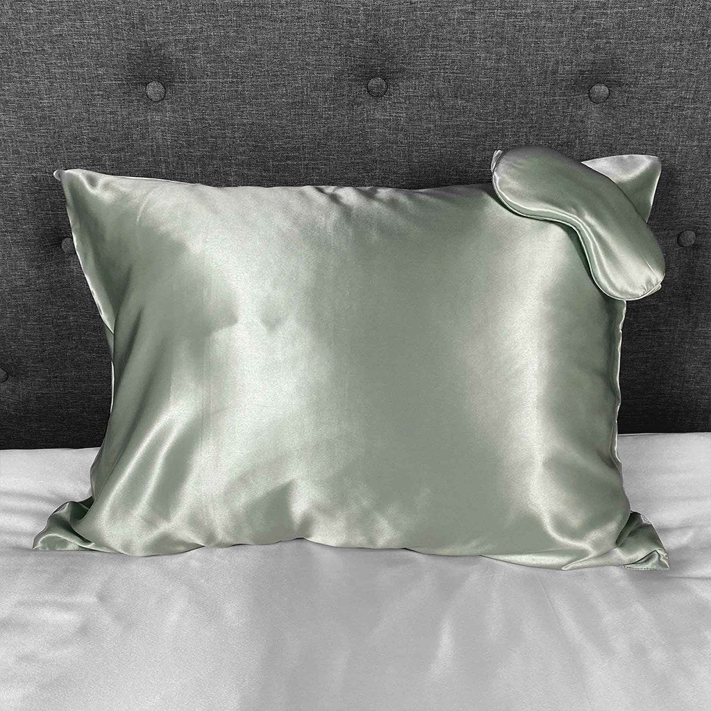 Sage silk pillowcase with matching sleep mask, offering a smooth and luxurious