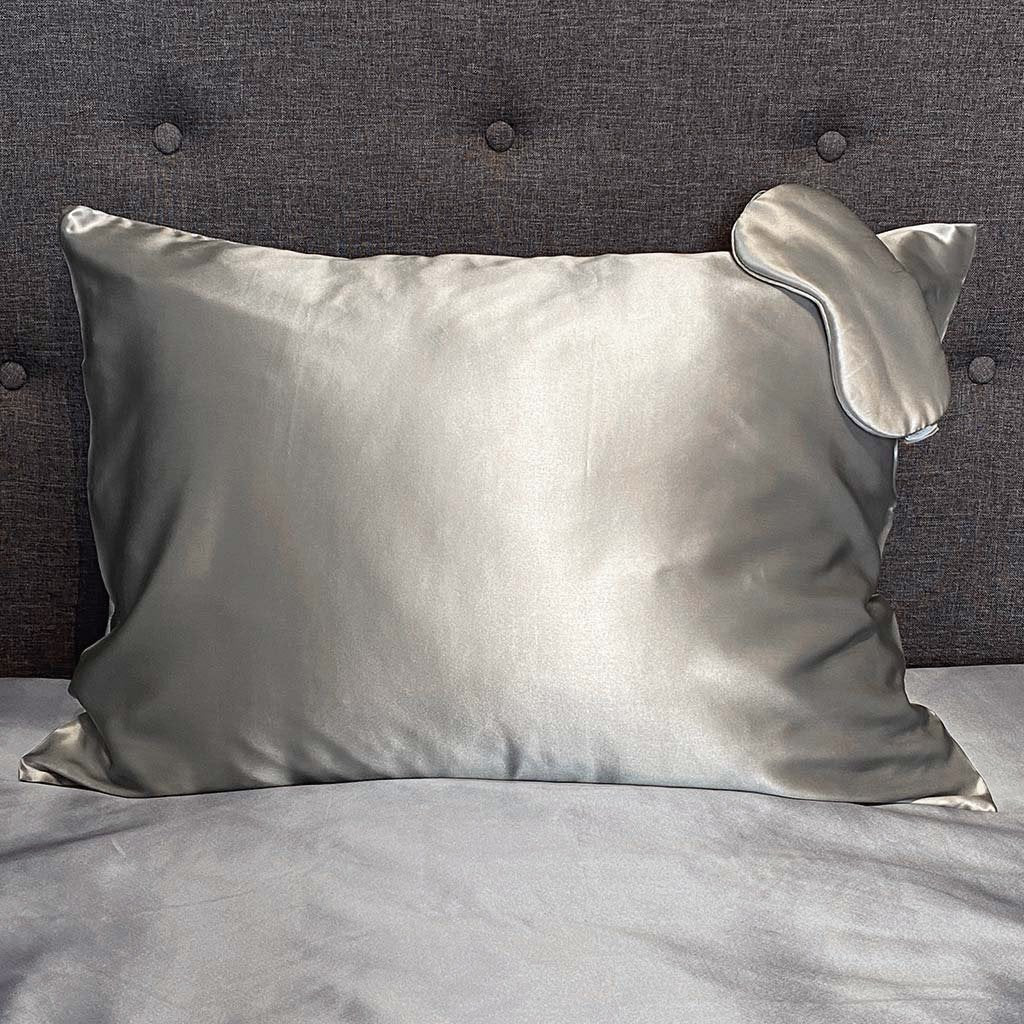 Silver silk pillowcase with matching sleep mask, offering a smooth and luxurious