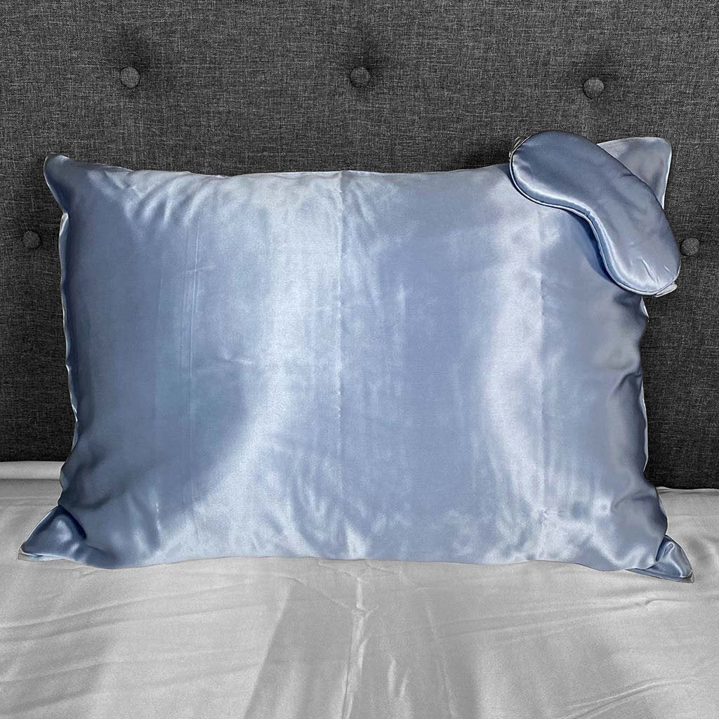 Steel blue silk pillowcase with matching sleep mask, offering a smooth and luxurious