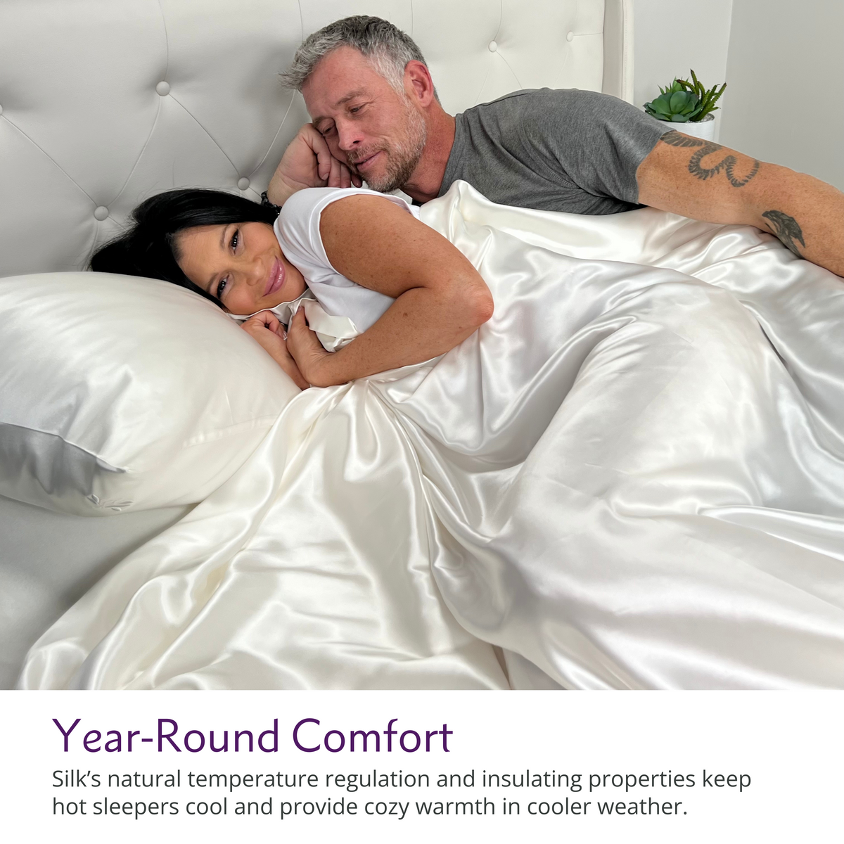 Couple relaxing on a bed with luxurious ivory silk sheets, enjoying comfort and elegance