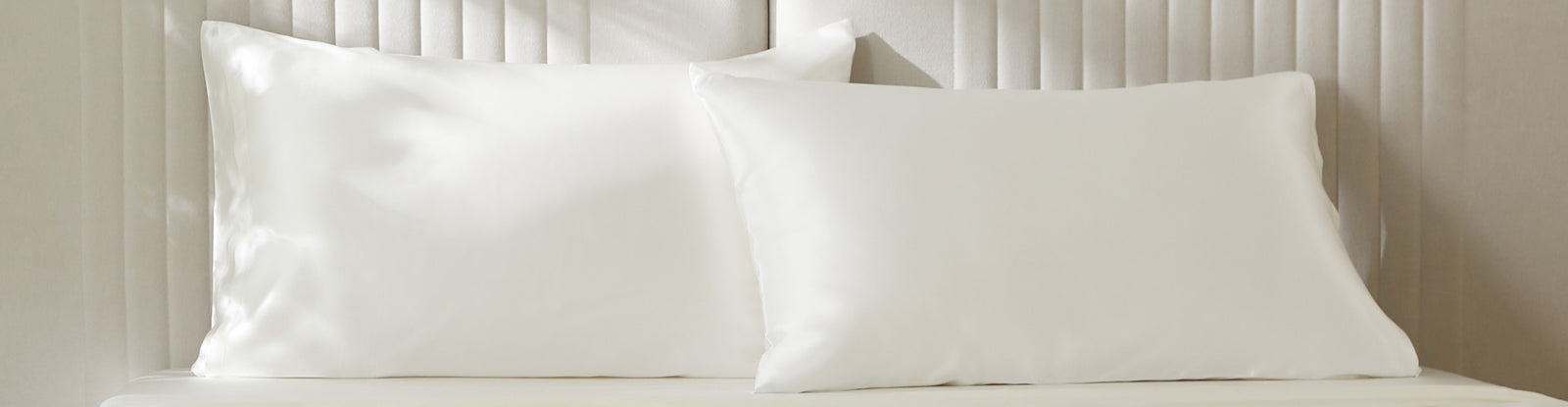 Mulberry Park Silks pure natural ivory silk pillowcases displayed on bed — luxury silk pillowcase collection.